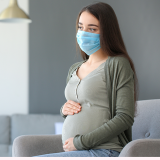 pregnant mom wearing mask
