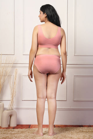 Full shot displays bra structure and fit under clothing.