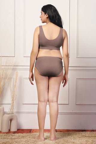 Full shot displays bra structure and fit under clothing.