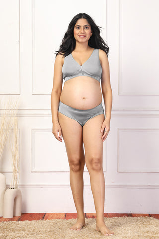 Back view shows wide supportive straps and hook-and-eye closure for fit.