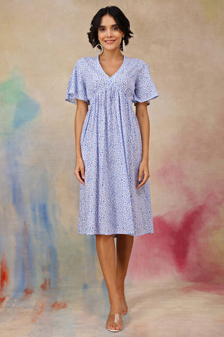 Woman wearing Anya Feminine Splatter Printed Dress In Flowy Textured Cotton Cambric in Red - Pre & Post Pregnancy