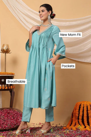 High-quality image of the Polyester texture and finish of the Elegant Turquoise Festive Suit Set.