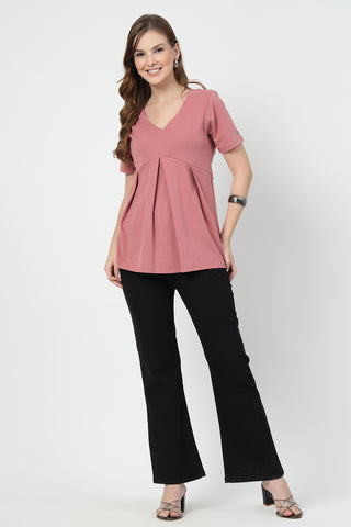 Close-up texture of Pleated Cotton Maternity Nursing Top - Deep Salmon in pink, showing the soft Cotton fabric.