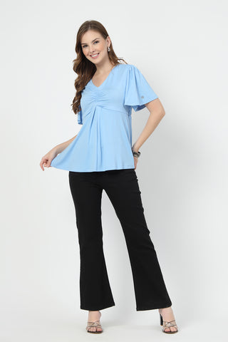 New mom wearing sky-blue Maternity Tops; shows flattering post-delivery fit and Zip.