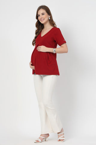 Detail shot of Cotton fabric; shows stretch and red color/print.