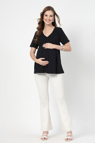 Detail shot of Cotton fabric; shows stretch and black color/print.