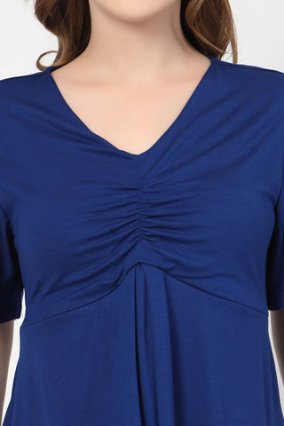 New mom wearing blue Maternity Tops; shows flattering post-delivery fit and Zip.