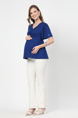 Detail shot of Viscose fabric; shows stretch and blue color/print.