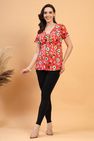 Detail shot of Cotton fabric; shows stretch and red color/print.