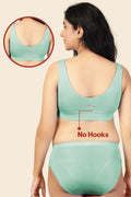 Full shot displays bra structure and fit under clothing.