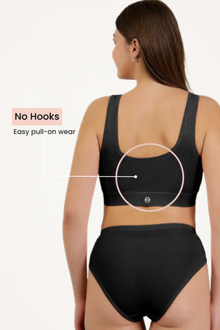 Black Feeding Bra side wing; coverage extends to armpit area for containment.