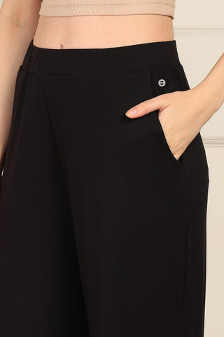 Zipless Front-Pleated Top & Maternity Pajama Set in Black, close-up: side pocket and elastic waistband | House of Zelena