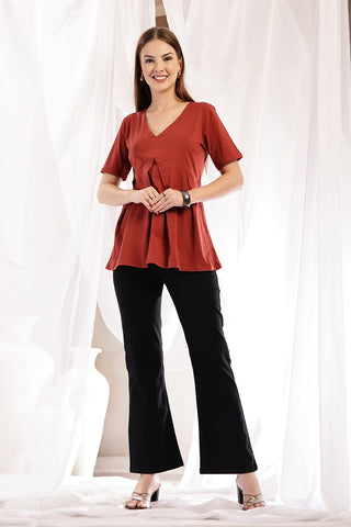 New mom wearing rust Maternity Tops; shows flattering post-delivery fit and Long Zip.