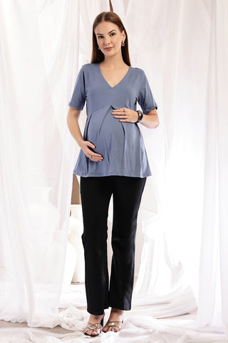 Detail shot of Cotton fabric; shows stretch and light-blue color/print.