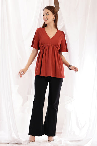 Rust Maternity Top; cut and material are suitable for wear during pregnancy.