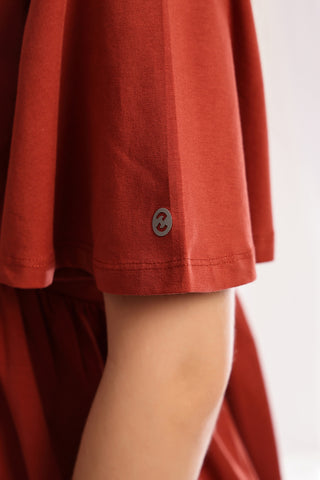 Rust Top V-Neck detail; neckline shape enhances style and neck coverage.