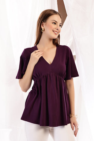Plum Top short sleeve detail; sleeve length provides arm coverage.