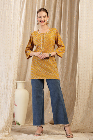 Ocher Booty Top detail; shows fit across the chest and shoulders.