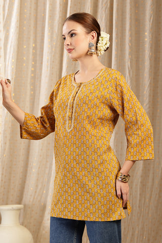 Ocher Booty Top back view; garment provides coverage and modesty.