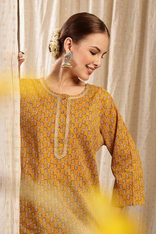 Ocher Booty Embroidered Neck; embroidery adds style to the maternity top.
