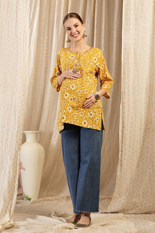 Gold Embroidered Neck; embroidery adds style to the maternity top.