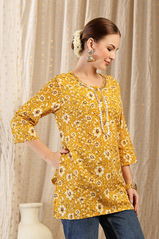 Gold Top hem; stitching detail ensures garment durability.