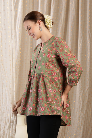 New mom wearing apple-green Maternity Tops; shows flattering post-delivery fit and Zipless.