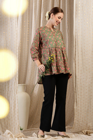 Close-up texture of Maternity Zipless Feeding Peplum Top - Sage in apple-green, showing the soft Cotton fabric.