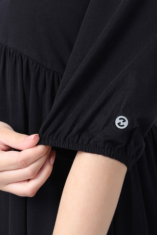 Woman wearing Maternity & Nursing Knee-Length Cotton Dress with Pocket in Black - Pre & Post Pregnancy