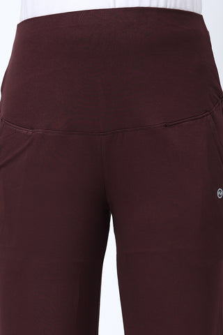 Model wearing Dark Chocolate Pants; high waist band covers belly for full support.