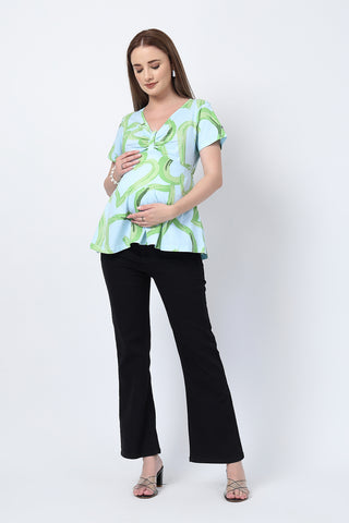 Detail shot of Cotton fabric; shows stretch and pista color/print.