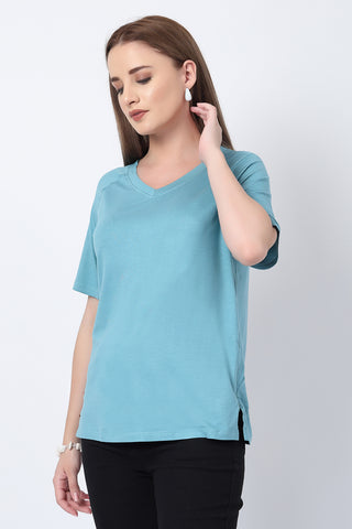 Smooth back view of light-sea-green Maternity Tops showing silhouette for comfort.