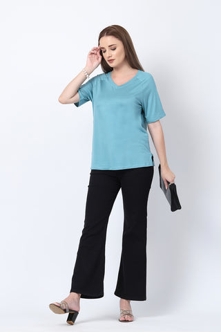 Styling detail of Sea Green Solid Nursing Top with Side Zip Access, highlighting light-sea-green print and Maternity Tops design.