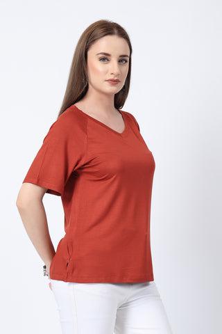 New mom wearing rust Maternity Tops; shows flattering post-delivery fit and Long Zip.