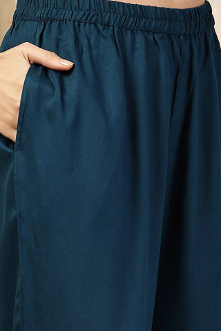 Model action shot of the Embroidered Floral Foil Kurta Set, demonstrating ease of movement and fit.