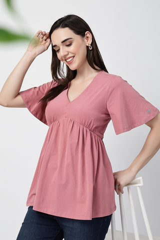 Styling detail of V-Neck Cotton Maternity Nursing Top - Deep Salmon, highlighting pink print and Maternity Tops design.