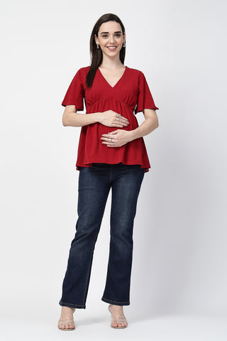 Detail shot of Cotton fabric; shows stretch and red color/print.