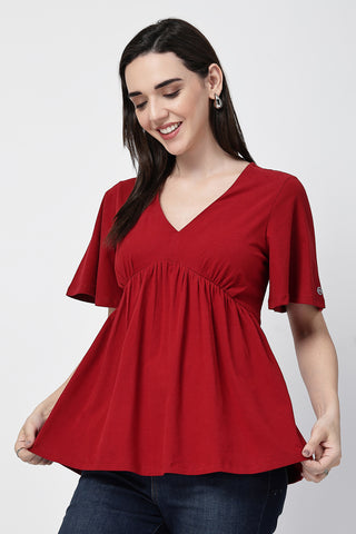 Smooth back view of red Maternity Tops showing silhouette for comfort.