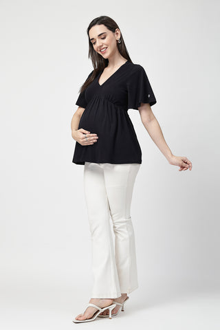 Detail shot of Cotton fabric; shows stretch and black color/print.