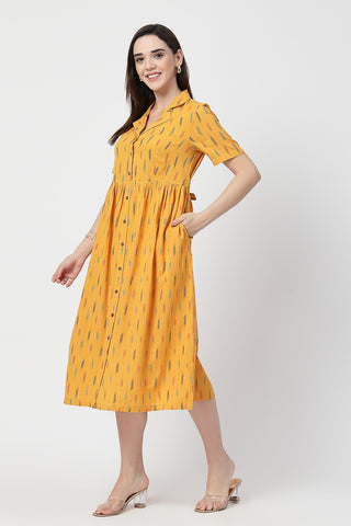 Woman wearing Ikat Print Zipless Feeding Dress in Mustard Yellow - Pre & Post Pregnancy