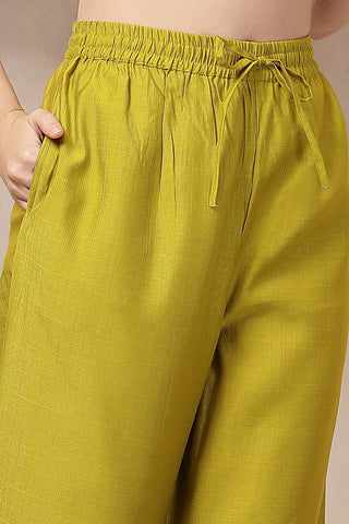 Side profile of the Mustard Yellow Concealed Suit Set, showing the smooth drape of the Roman Silk fabric.