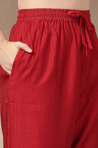 Comfort-focused image of the Red Concealed Zip Roman Silk Suit Set, designed for style through pregnancy and postpartum.