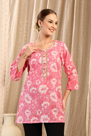 Coral Top hem; stitching detail ensures garment durability.