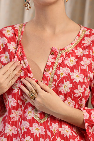 Model wearing Red Floral Top; garment provides coverage and fit for a changing body.