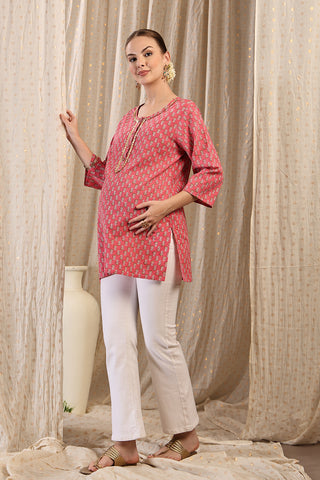 Pink Booty Embroidered Neck; embroidery adds style to the maternity top.