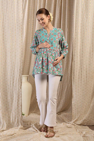 Detail shot of Cotton fabric; shows stretch and mint-green color/print.