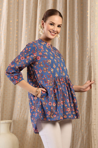 New mom wearing federal-blue Maternity Tops; shows flattering post-delivery fit and Zipless.