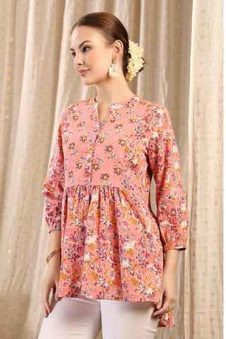 Styling detail of Maternity Zipless Feeding Peplum Top - Peach, highlighting peach print and Maternity Tops design.