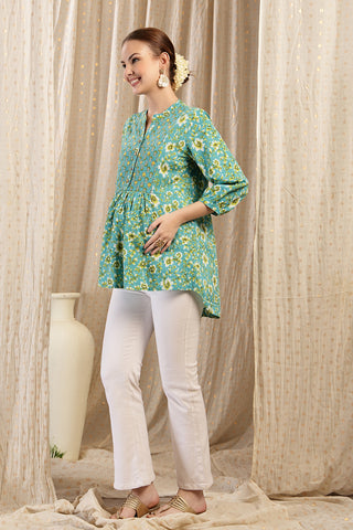 Side or angle view of Maternity Zipless Feeding Peplum Top - Sea Green showing the Maternity Tops silhouette and fit.