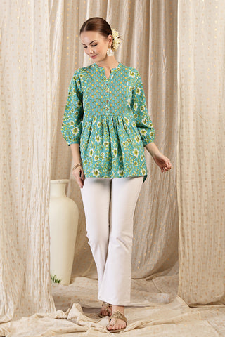 Close-up texture of Maternity Zipless Feeding Peplum Top - Sea Green in sea-green, showing the soft Cotton fabric.